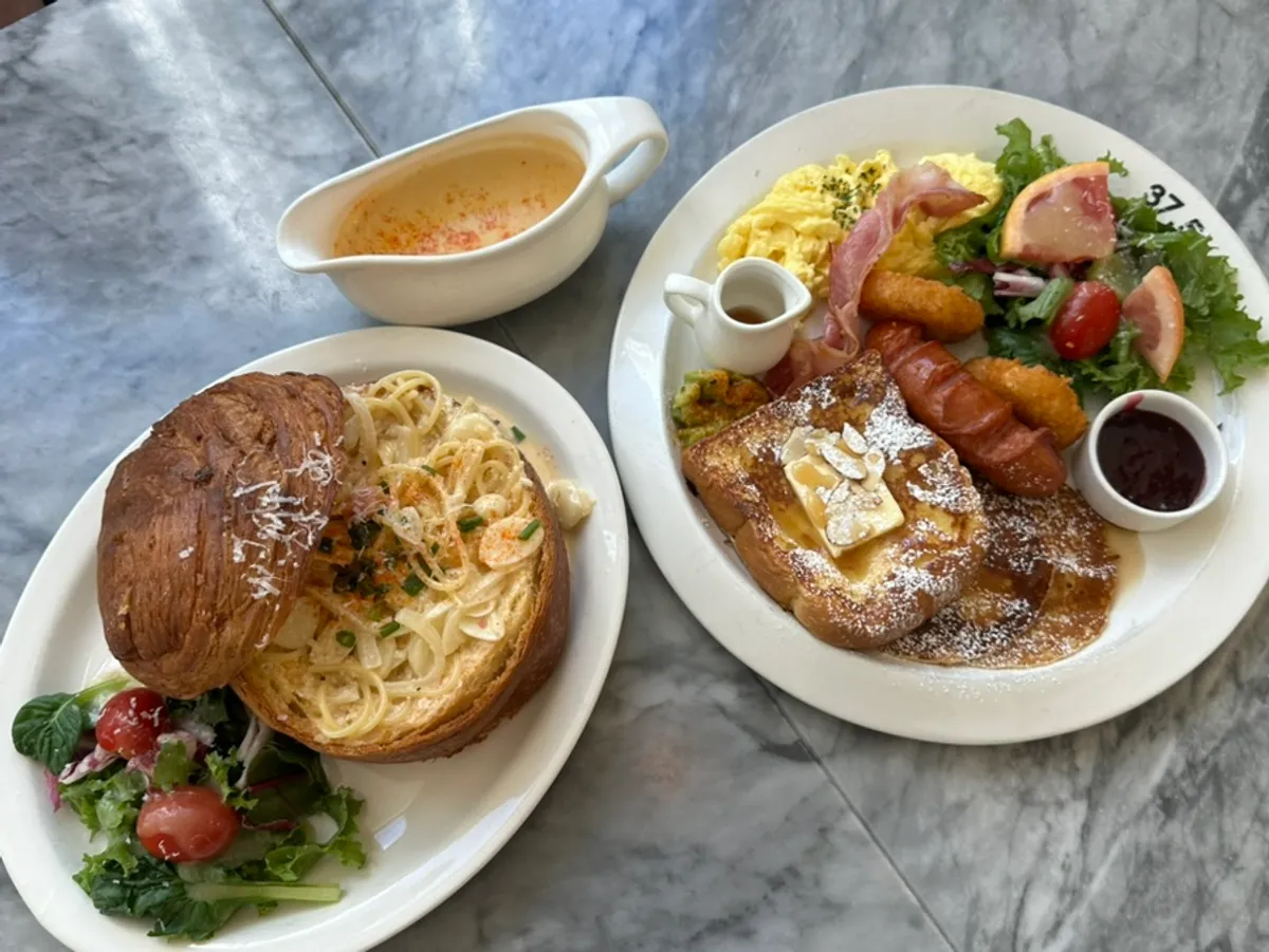 Table set with American brunch and pollock roe cream pasta