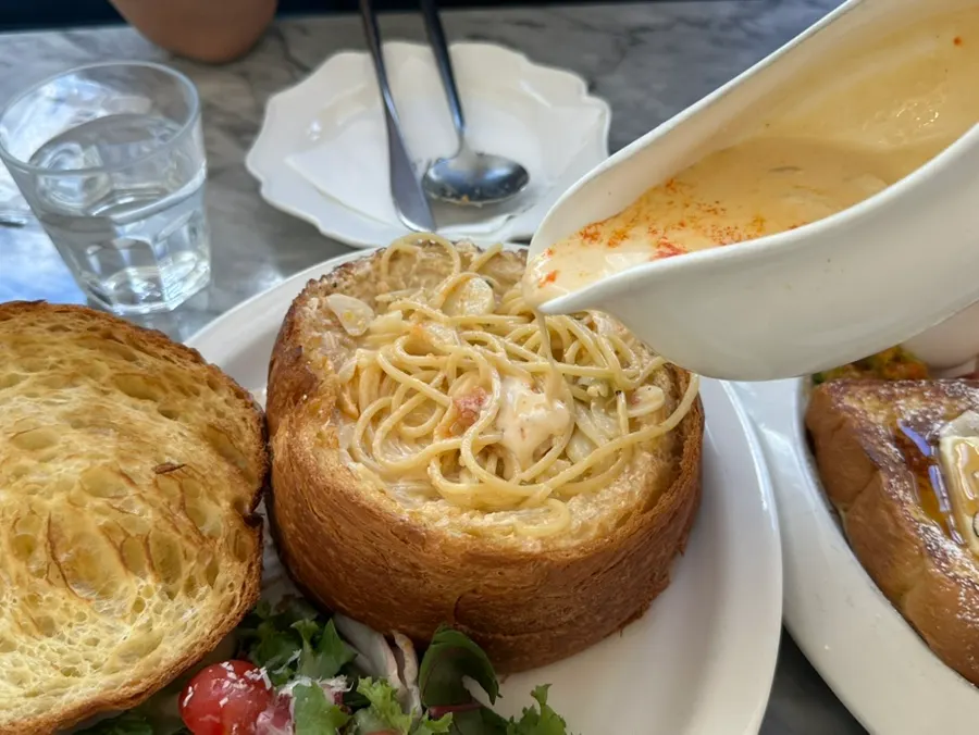 Salad served alongside the pasta