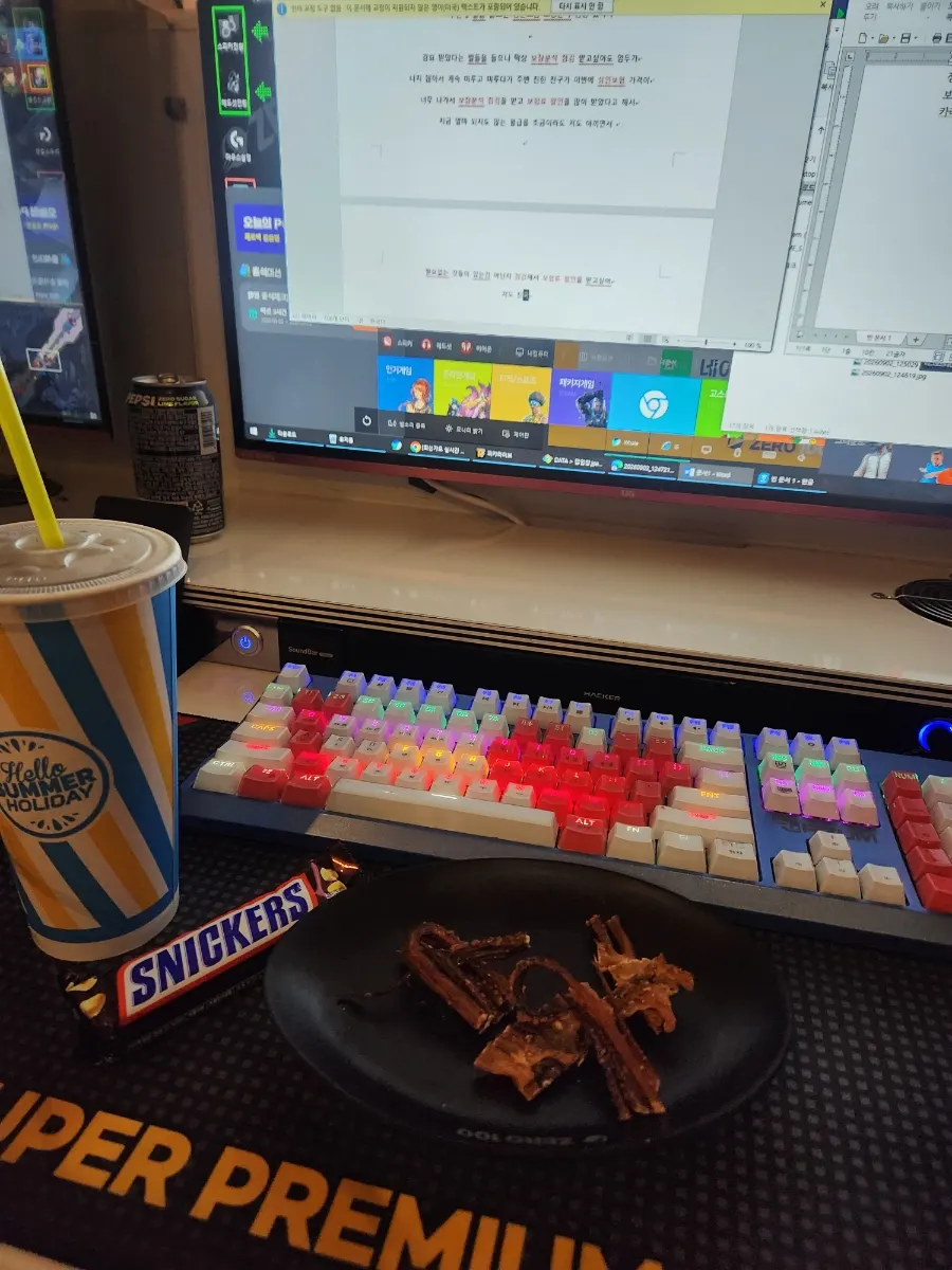 Snack set of short chicken legs, cola, and a chocolate bar