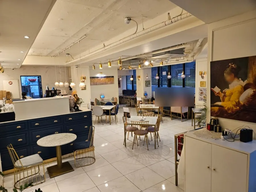 Interior with navy-toned counter and gold lighting