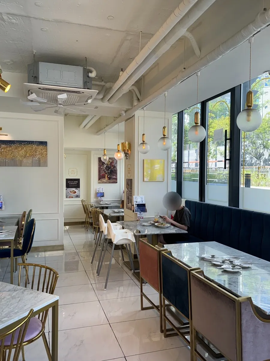 Restaurant interior with tables by the windows