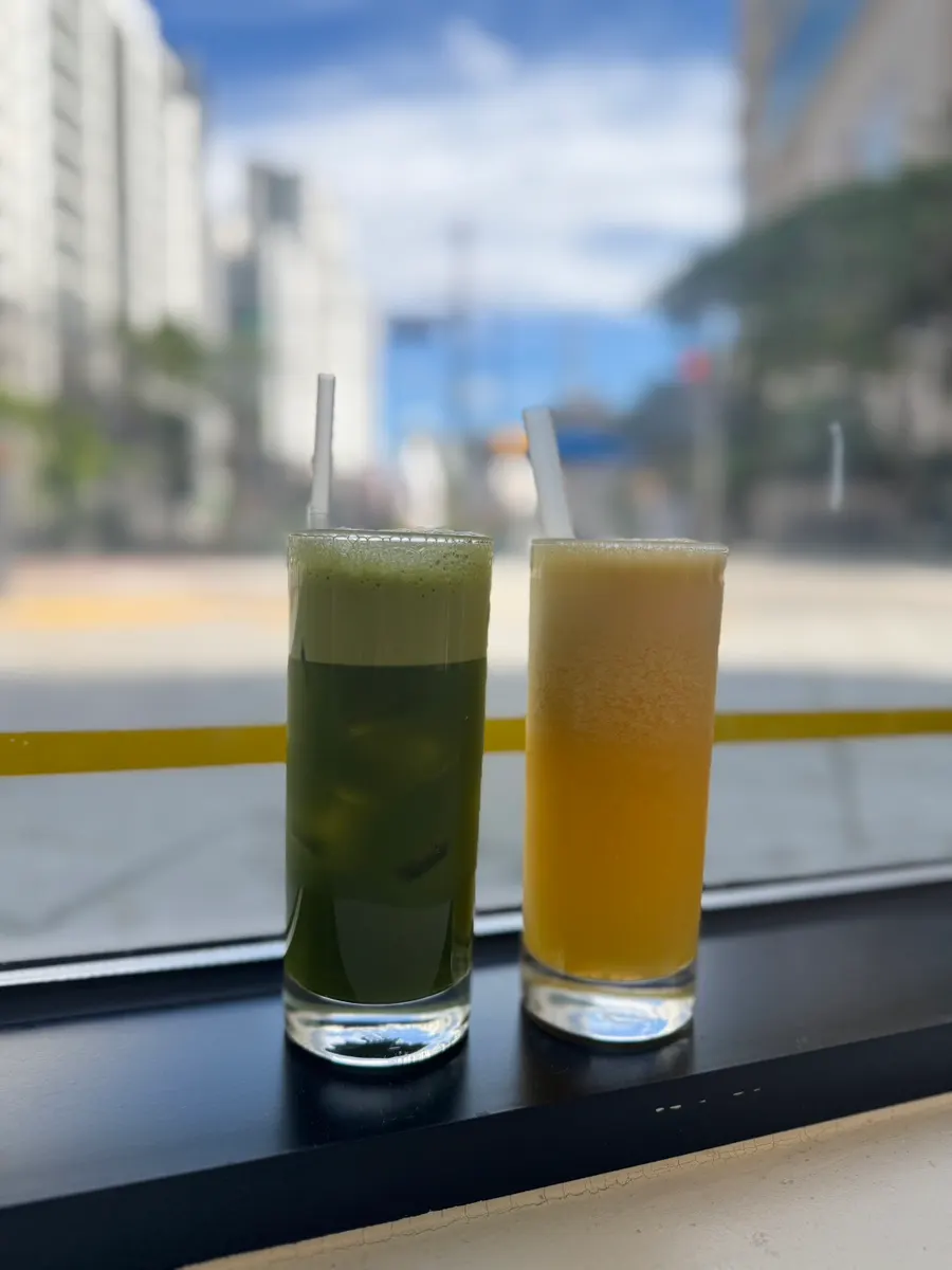 Freshly squeezed orange juice and apple-kale juice