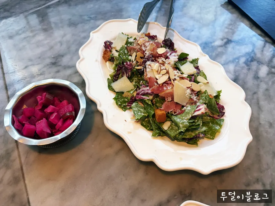 House Caesar salad with romaine, bacon, and croutons
