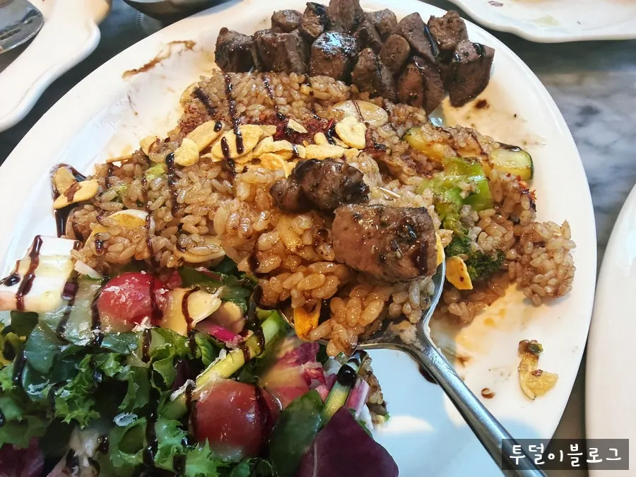 A meal set with pilaf and salad together