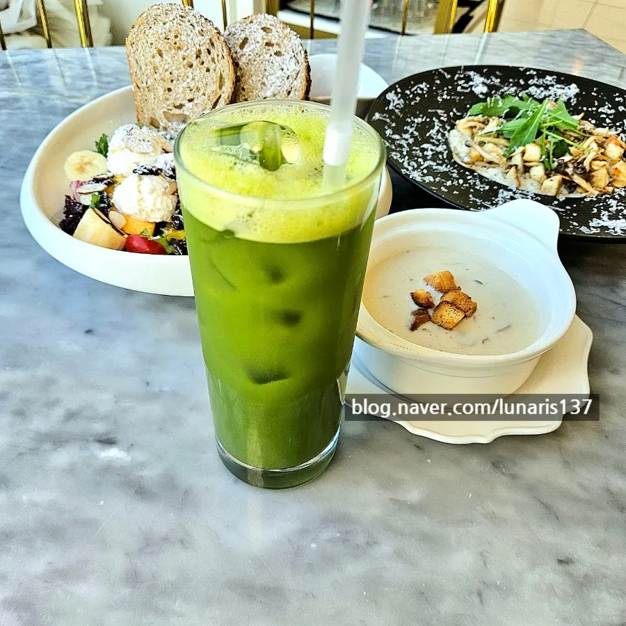 A glass of apple kale juice