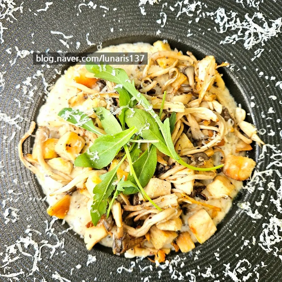 Cream risotto topped with roast chicken and mushrooms