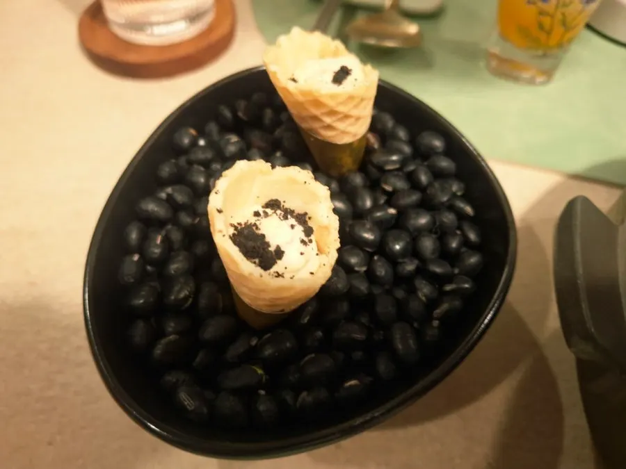 Two bite-sized dishes served in a sinseollo pot