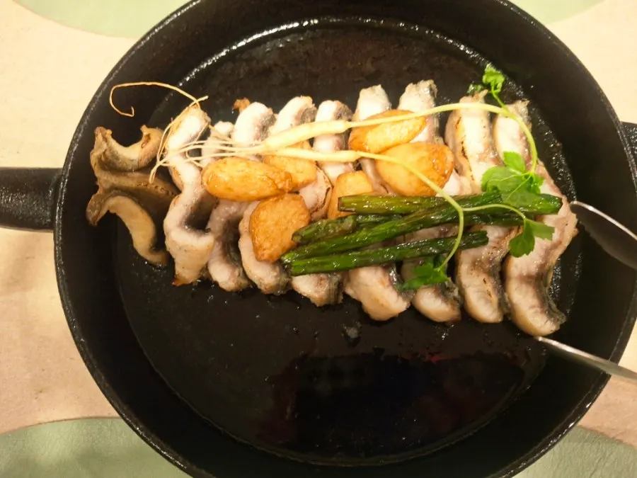 Straw-fire grilled eel with grilled garlic scapes and sprout ginseng
