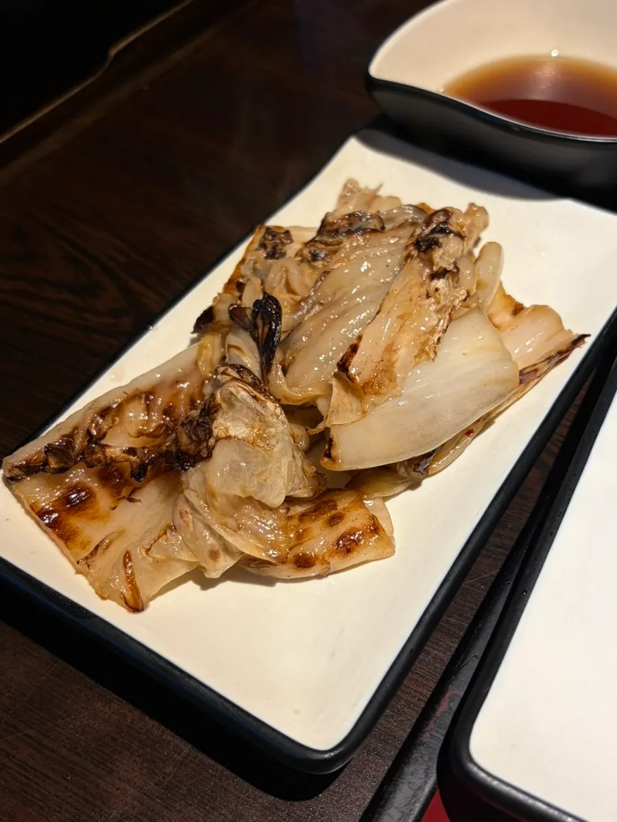 Grilled green onion soaked in soy sauce