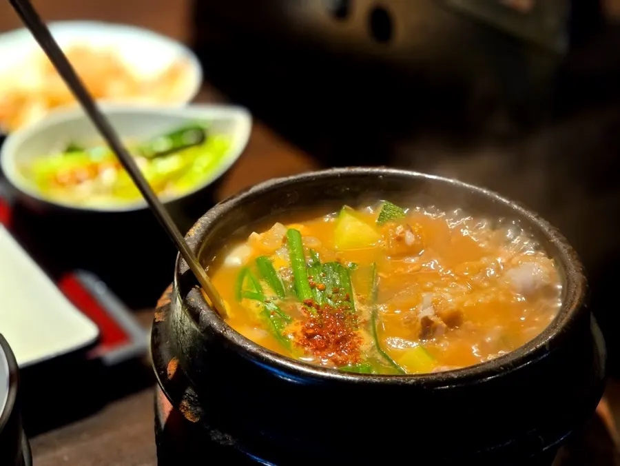 A bowl of donjang sulbap served bubbling hot