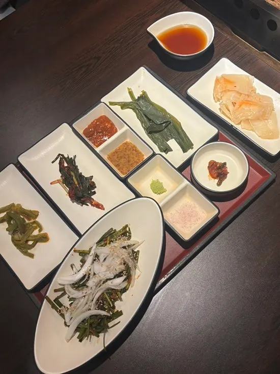Giun's basic banchan spread with salt, sauces, and white kimchi