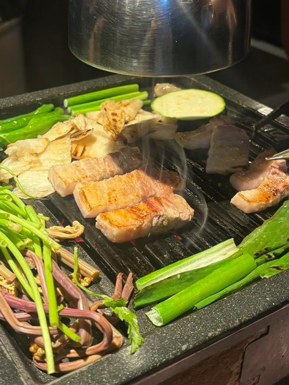 The Sulgiun Set with galbi samgyeopsal, hangjeongsal, gabrisal, and assorted vegetables
