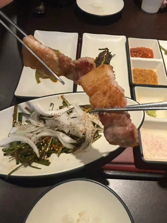 Thickly sliced galbi samgyeopsal on the grill