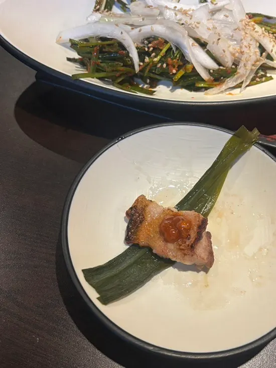 Various cuts cooking together on the grill