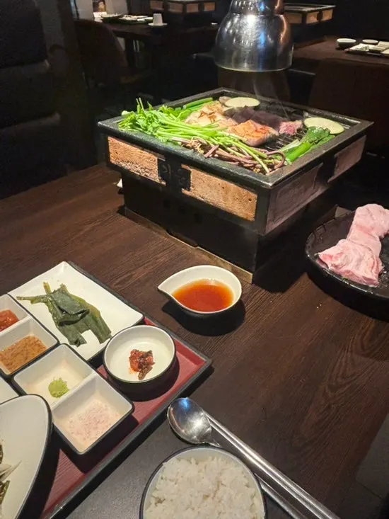A full spread of Giun's meat and side dishes