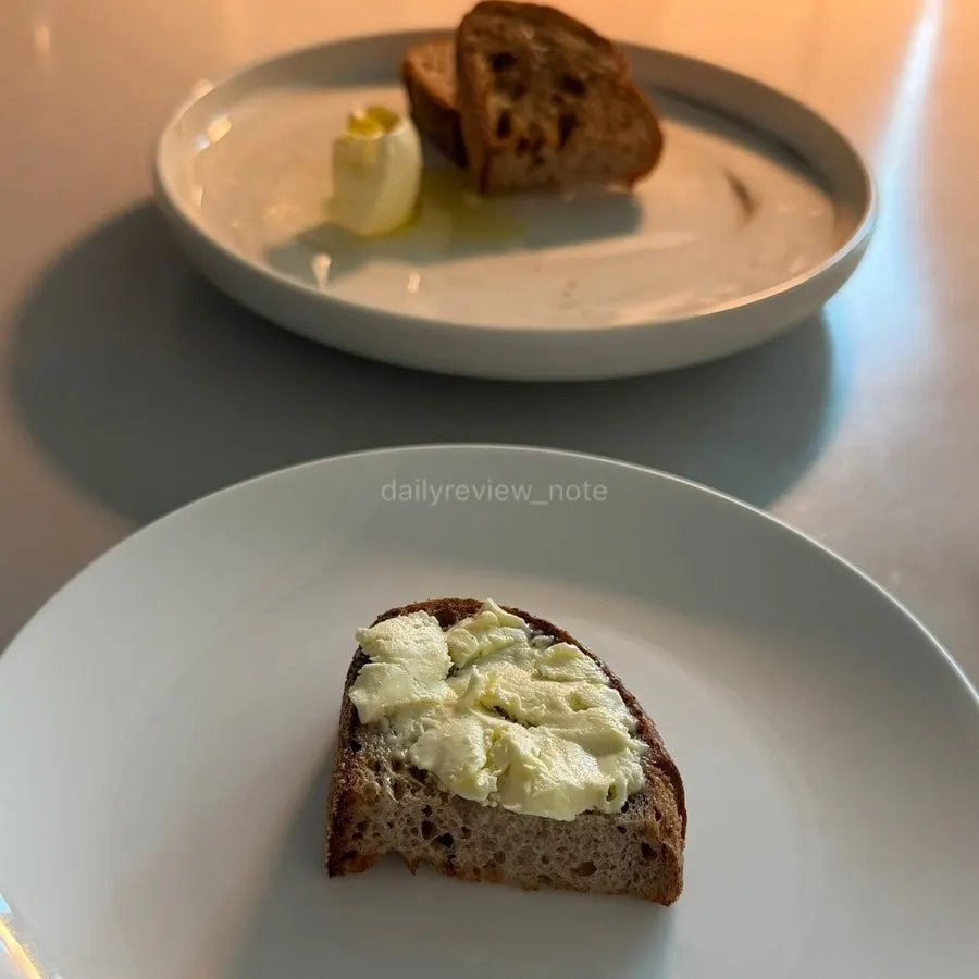 White bread with four slices and rose-shaped butter