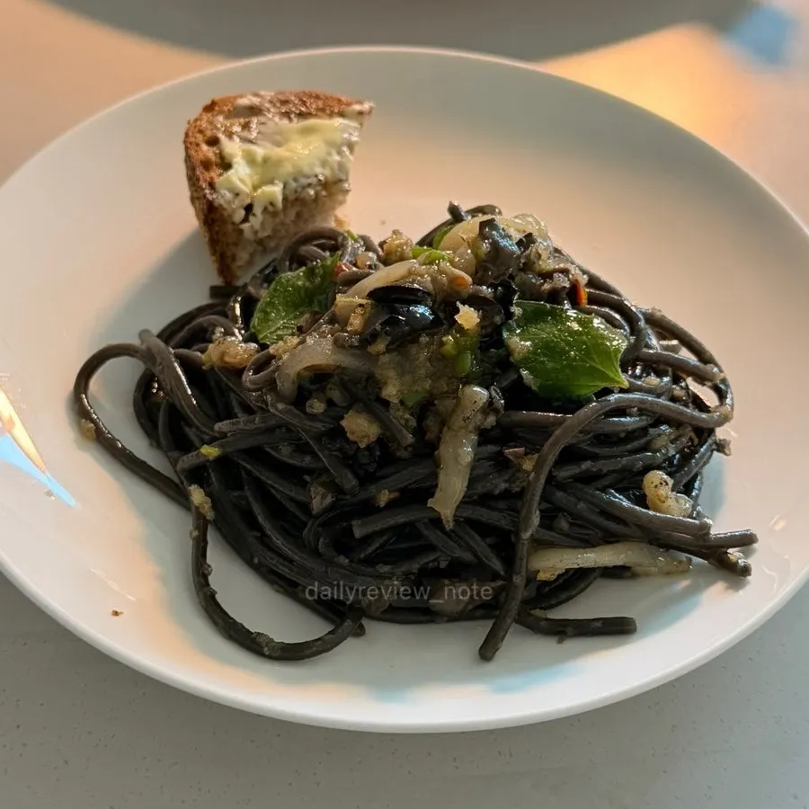 Cuttlefish tapenade pasta coated evenly in sauce