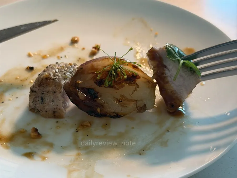 Jjondeuksal and onions portioned onto a small plate