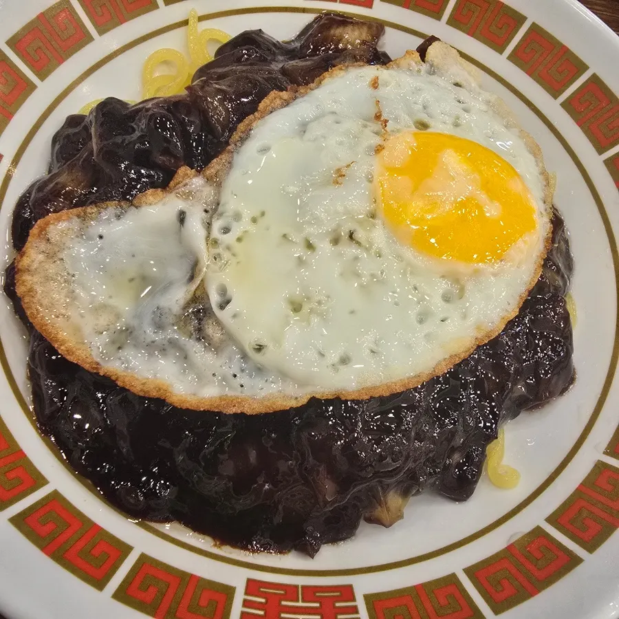 Jjajangmyeon topped with a fried egg at Glory Works