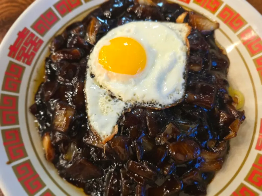 Jjajangmyeon topped with a fried egg at Glory Works