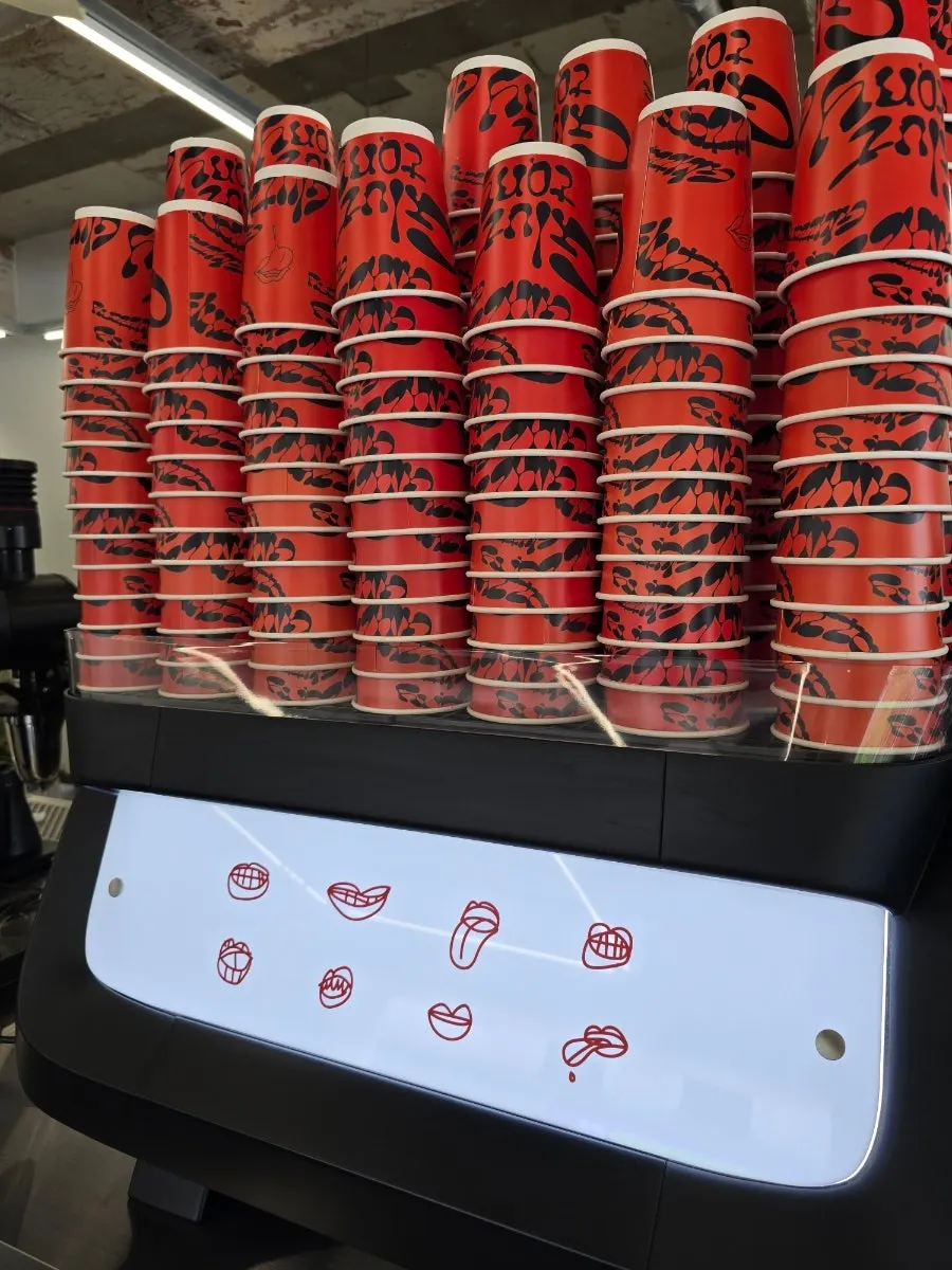 Whole cakes and takeout cups on display