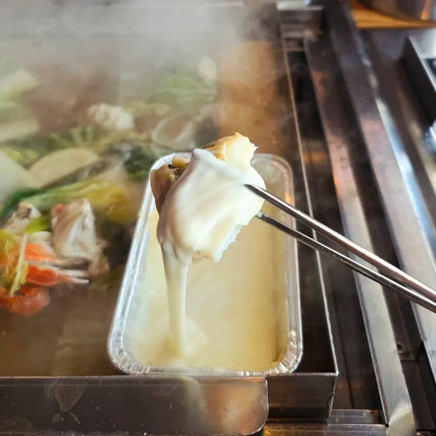Seafood in the steamed clam dish after about 10 minutes of cooking