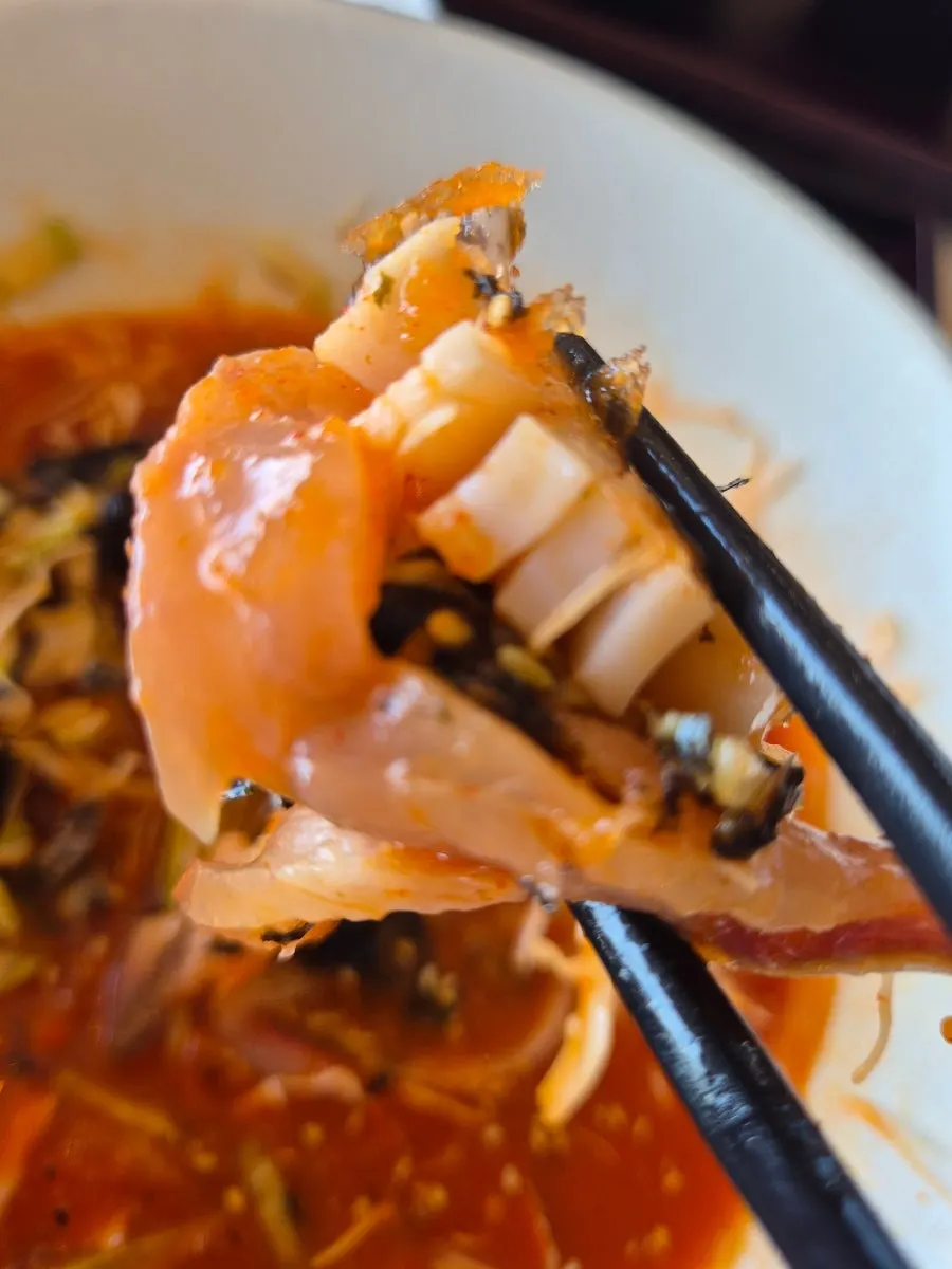 Pohang-style mulhoe topped with prepared live abalone