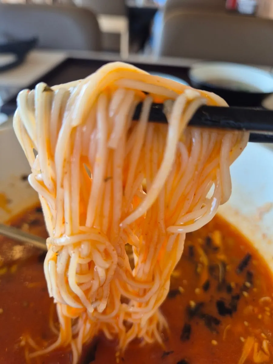 Close-up of raw fish soaking in the cold mulhoe broth