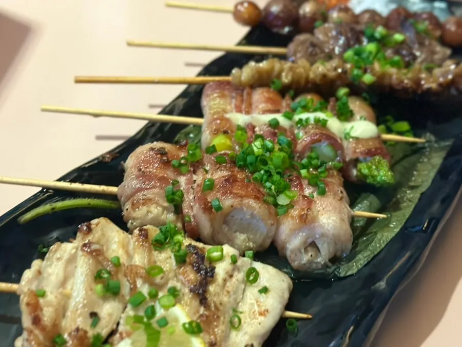 Skewers grilling on the hot plate