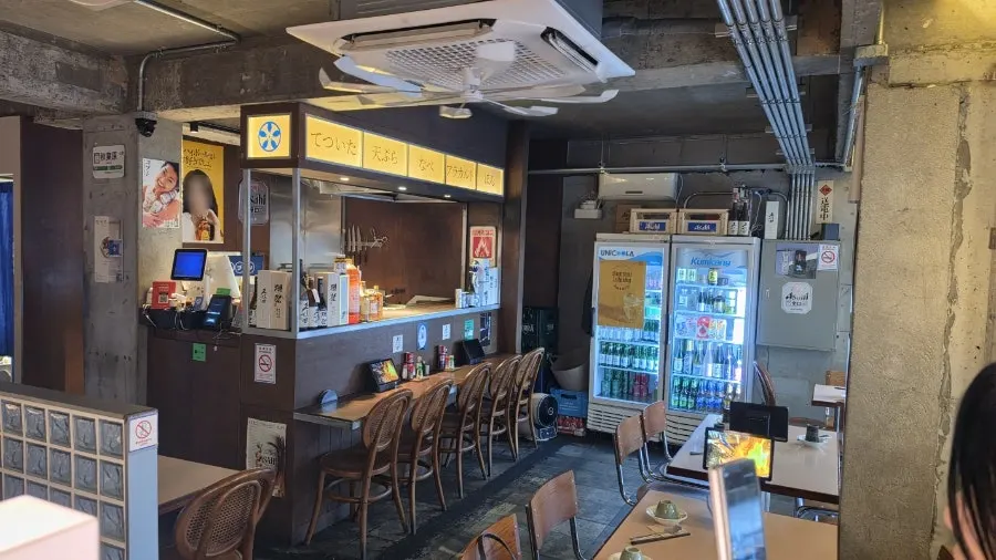 Wooden table seating inside Gobusi Nonhyeon Branch