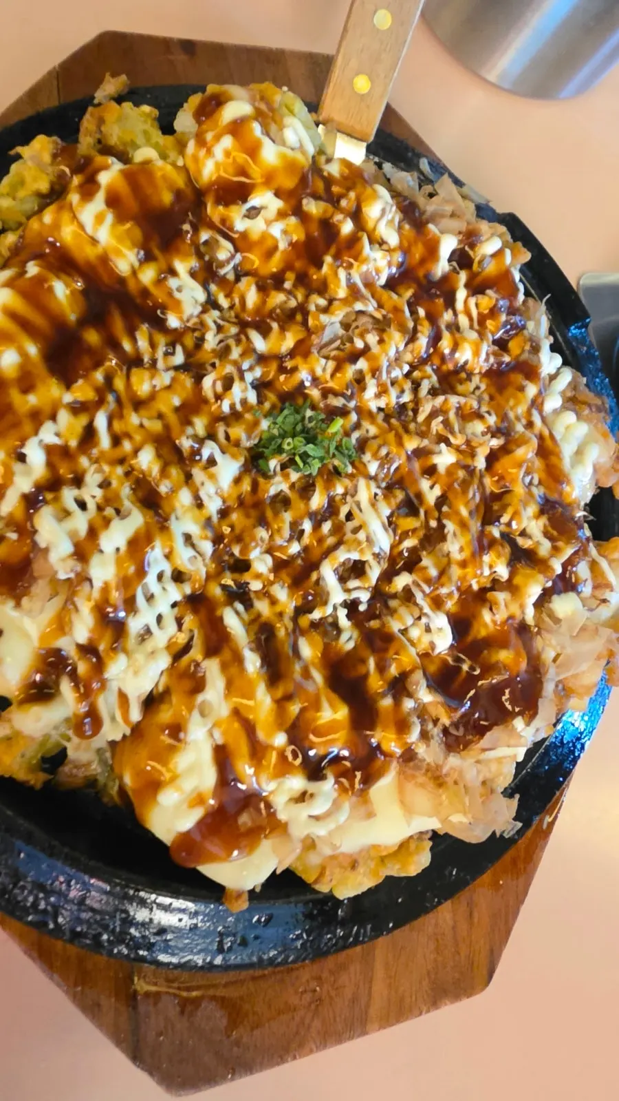 Cross-section of a cut piece of okonomiyaki