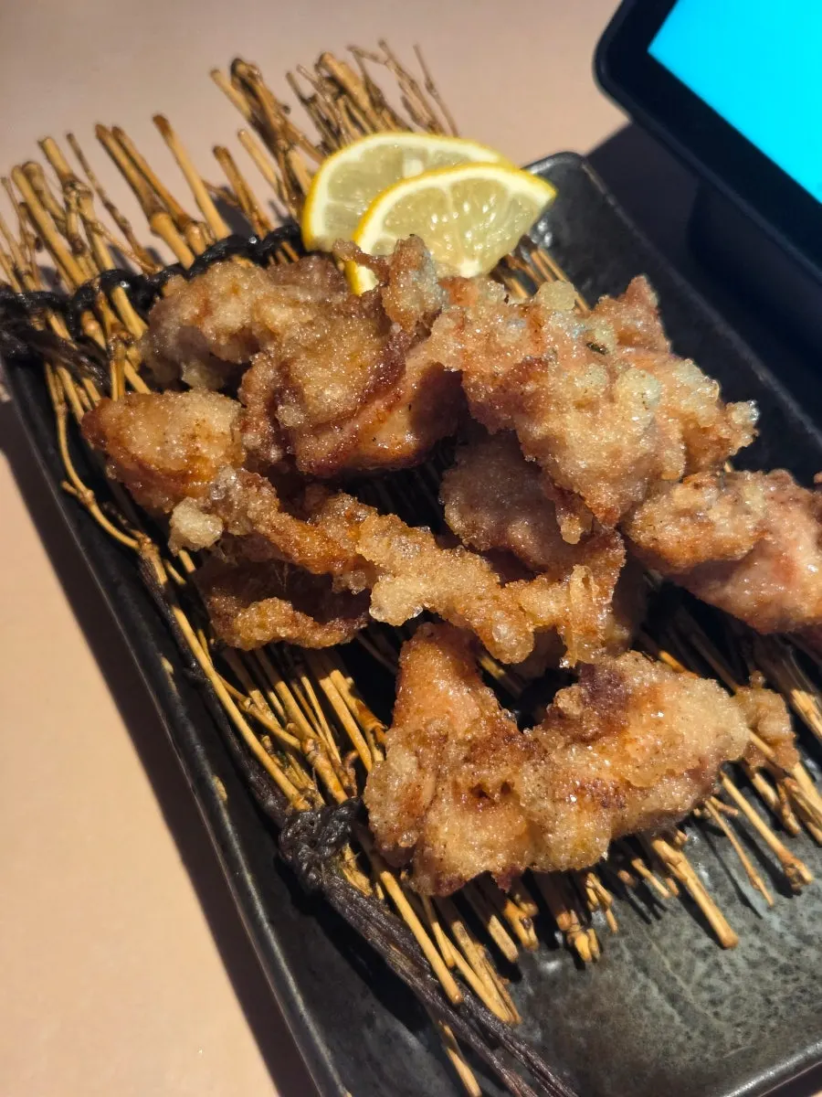 Bite-sized karaage served with lemon