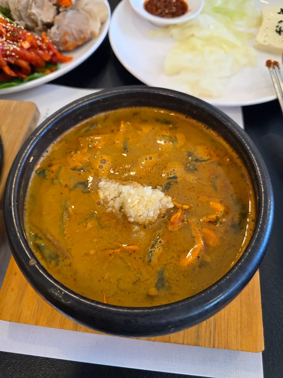 Loach soup packed with dried napa cabbage leaves and bracken fern