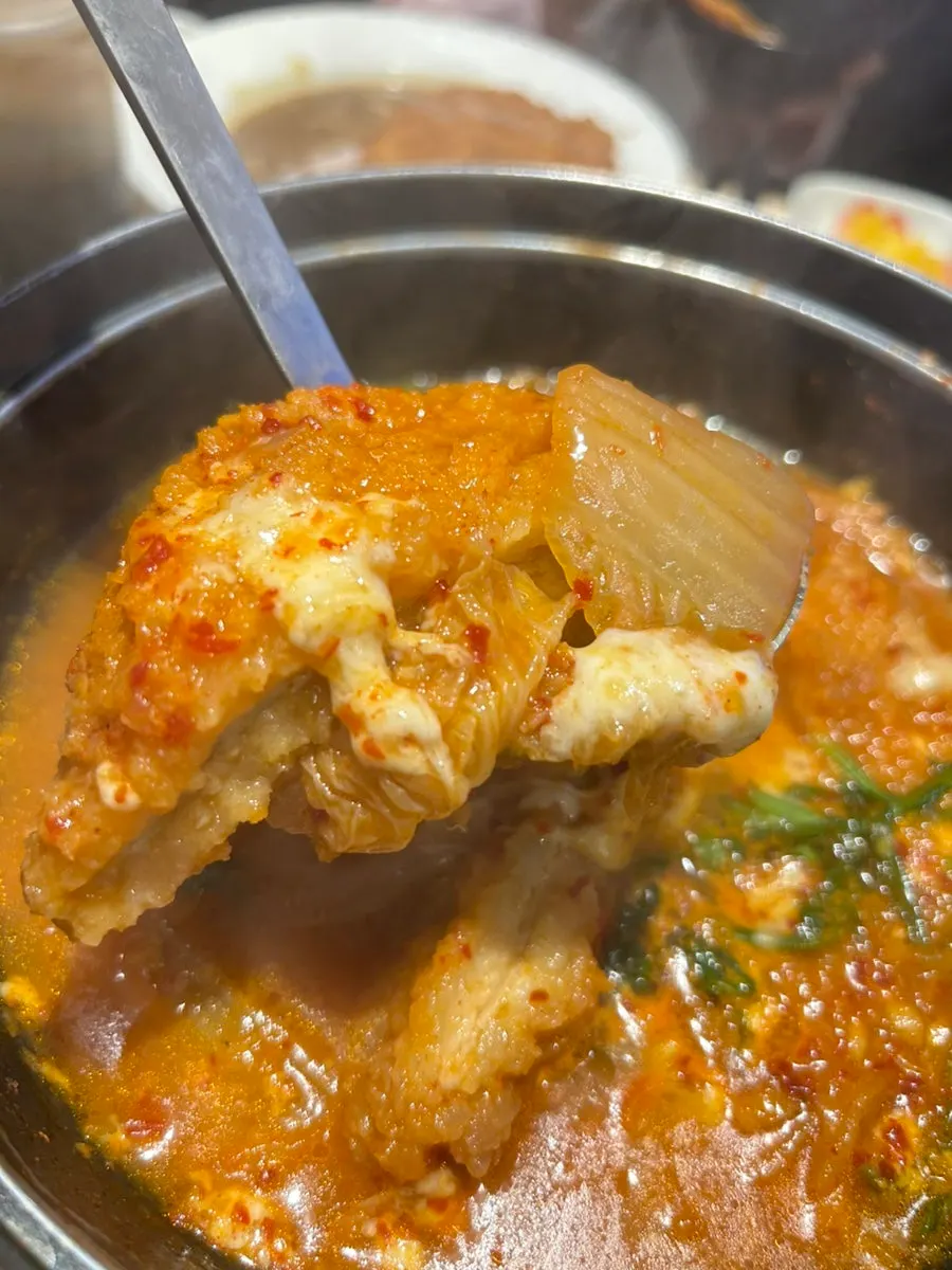 Stretchy mozzarella cheese in the kimchi cheese katsu nabe