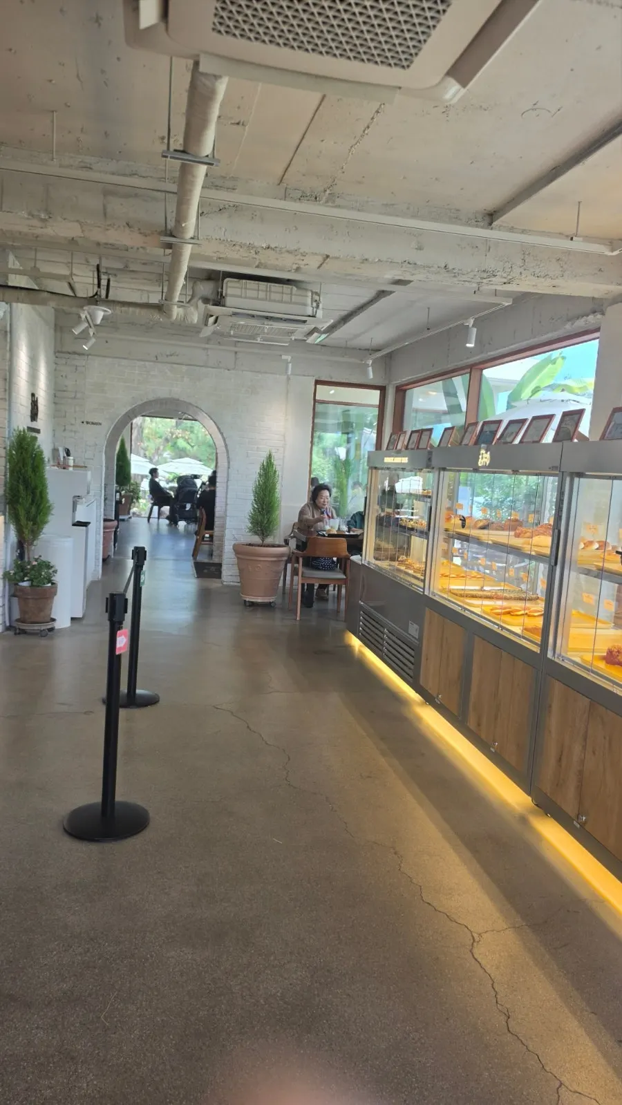 Café entrance with a garden atmosphere