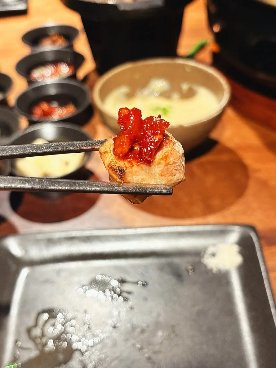 Aged samgyeopsal wrapped with scallions