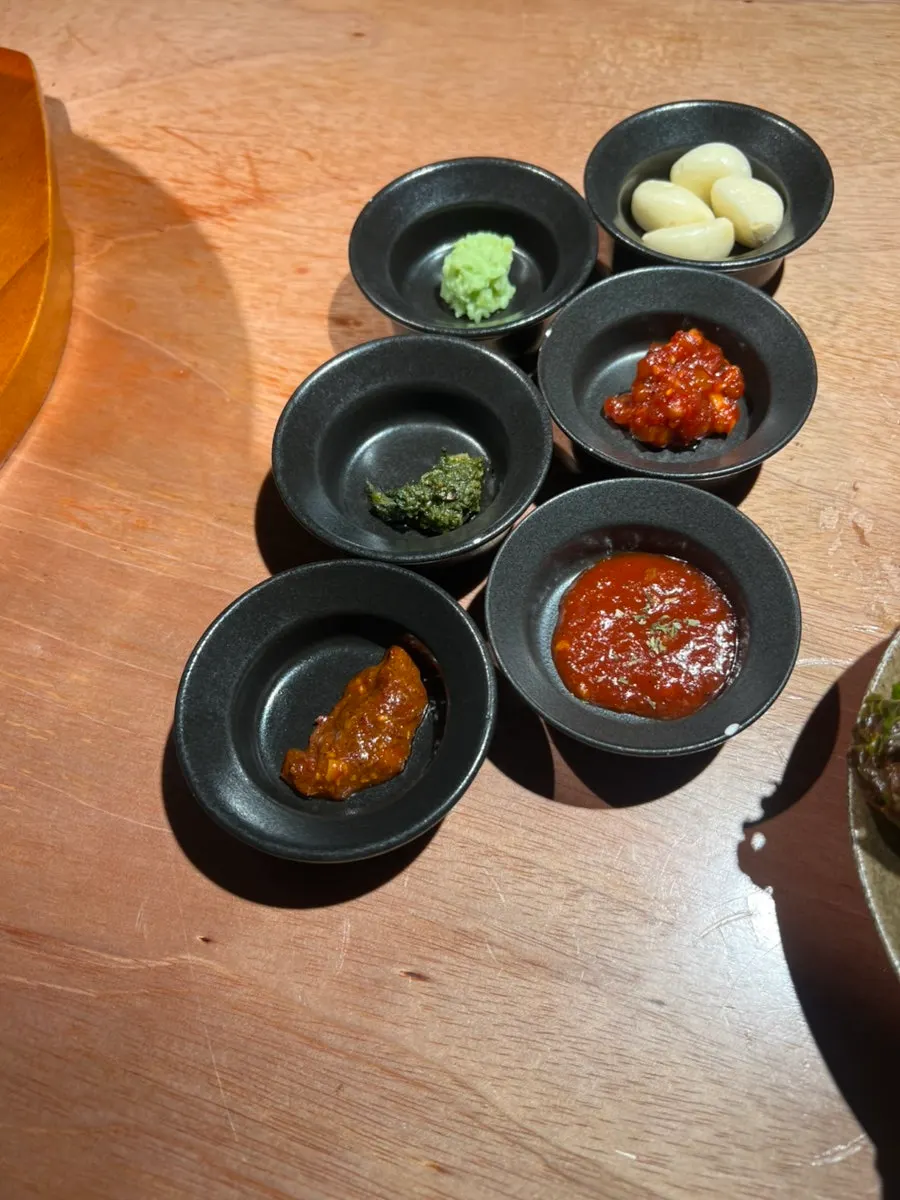 House-made sauce set including fresh wasabi, basil pesto, and galchi sokjeot