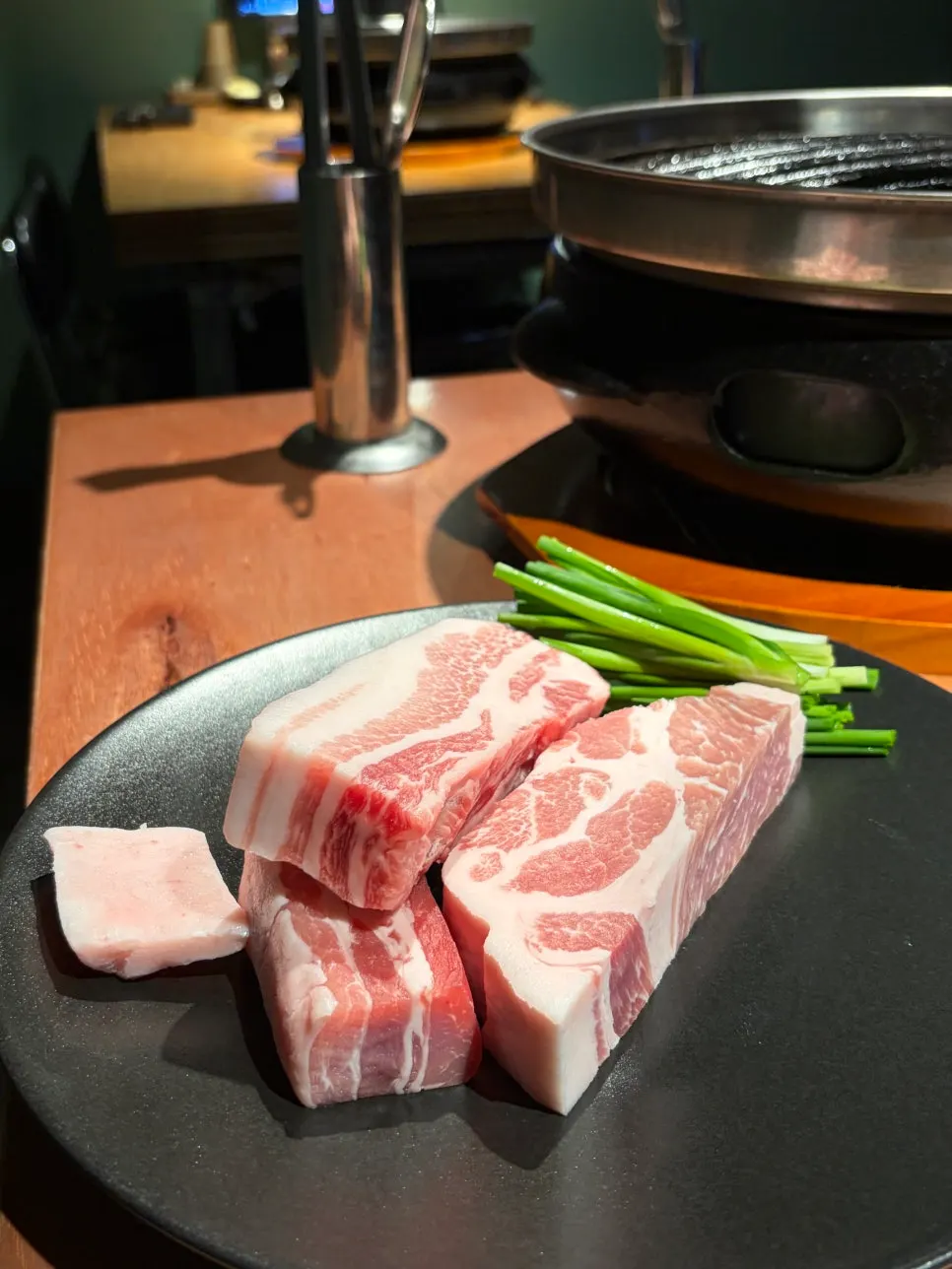 Table spread of aged pork belly and pork neck at Godansu Changwon Yongho Branch