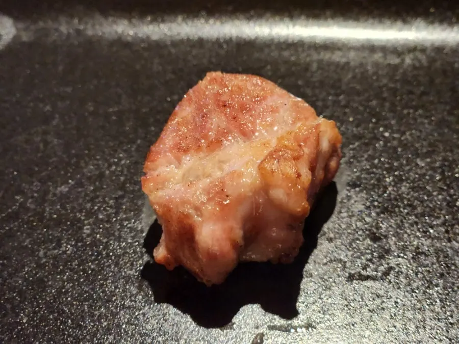 Fully cooked meat kept warm on the grill