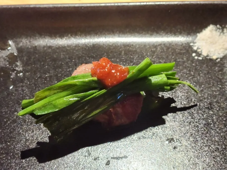 A grilled piece of pork neck