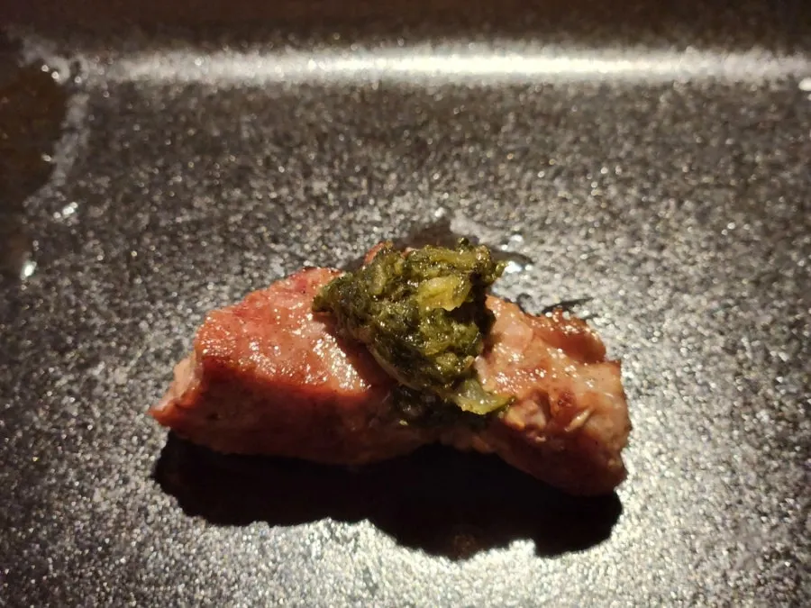 Pork neck topped with sauce
