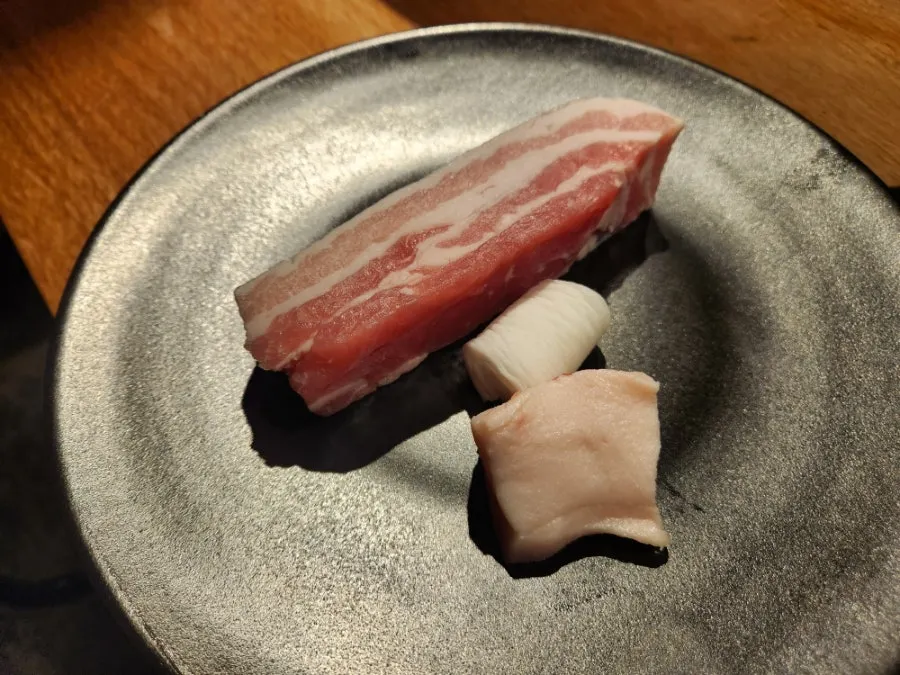 The extra serving of thick pork belly that was ordered