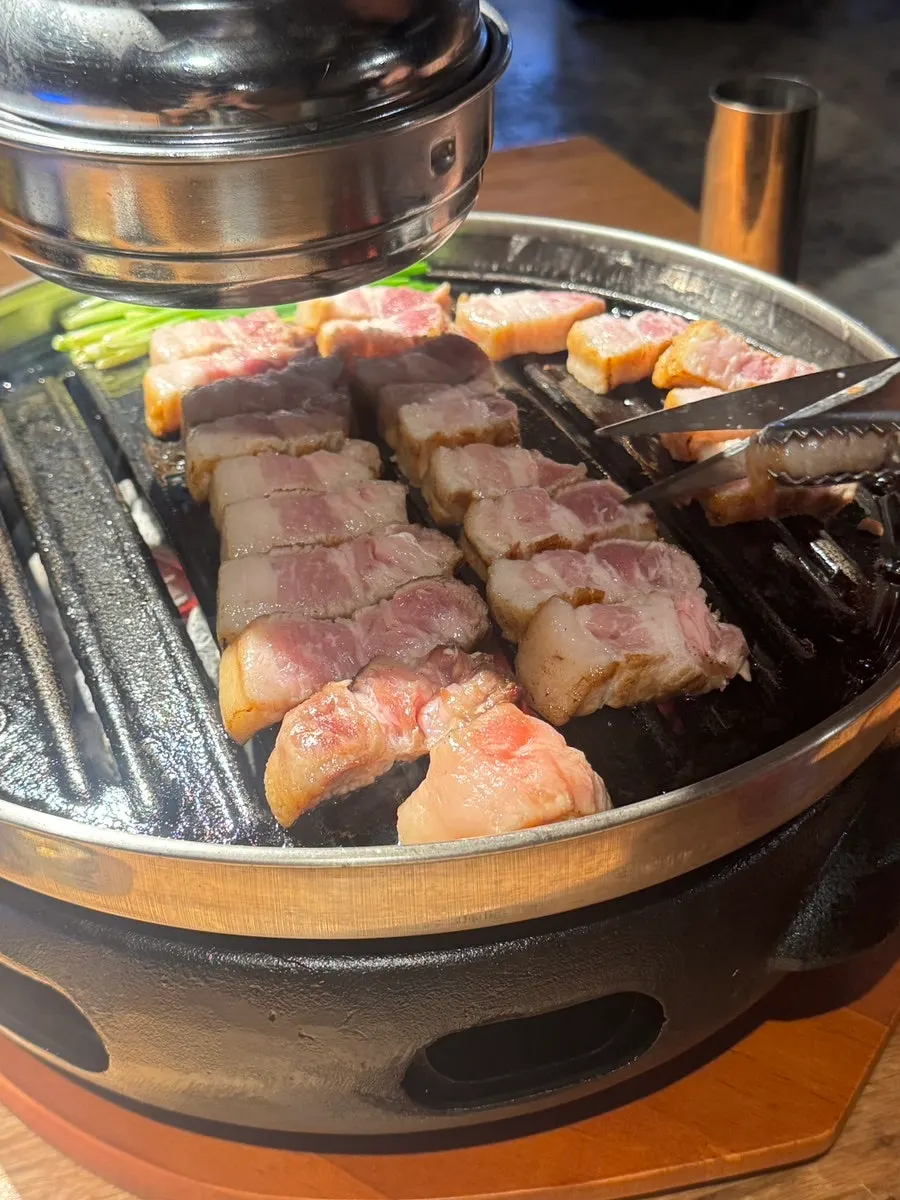 Staff grilling each side of the meat