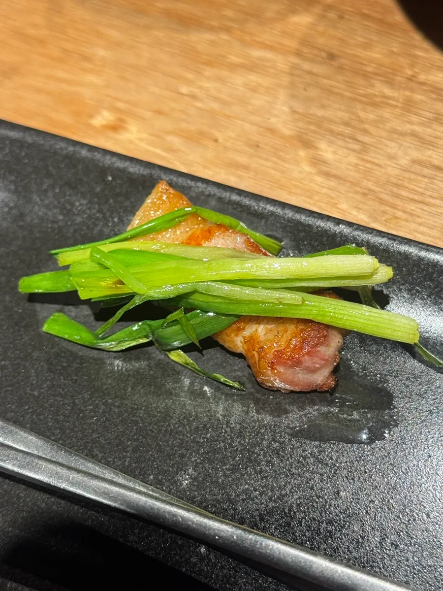 Pork belly paired with grilled green onion