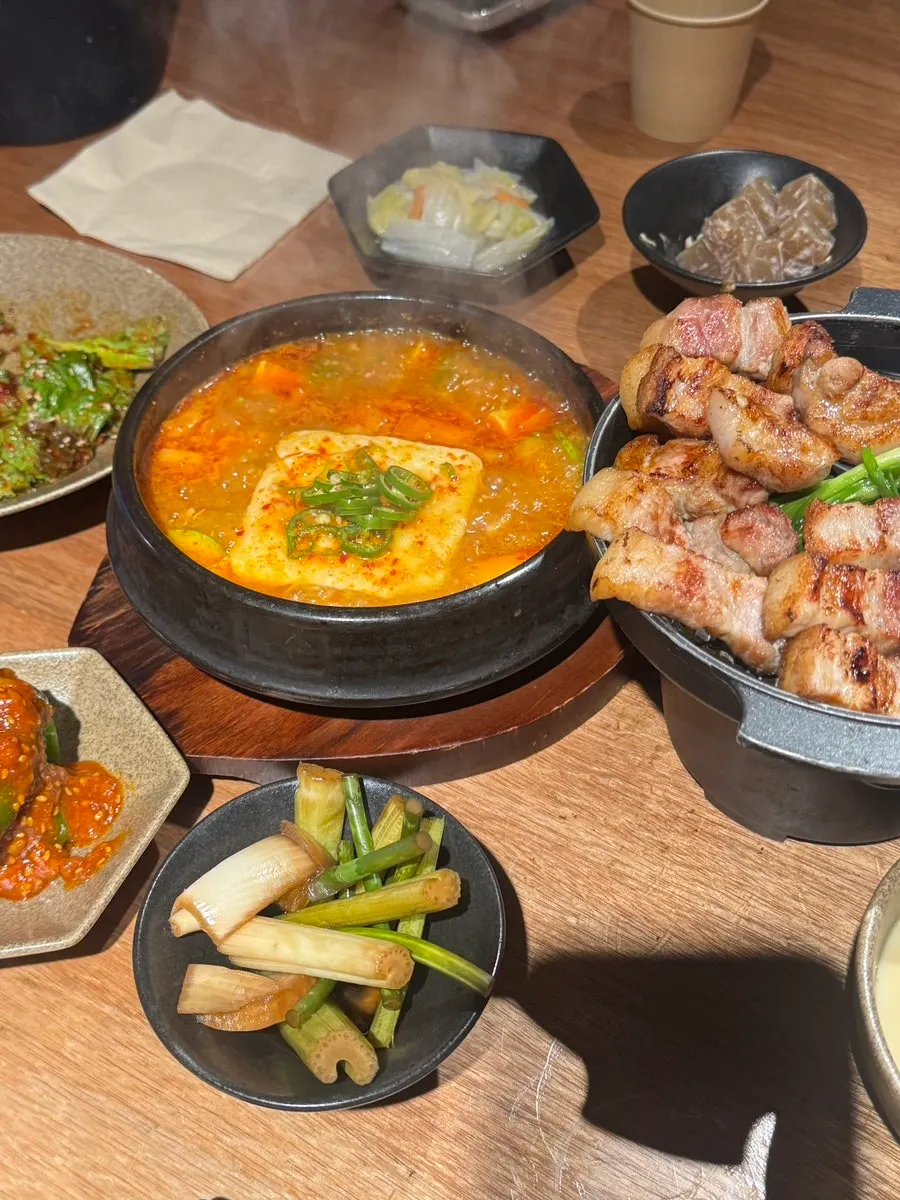 Table set with meat and side dishes near the end of the meal