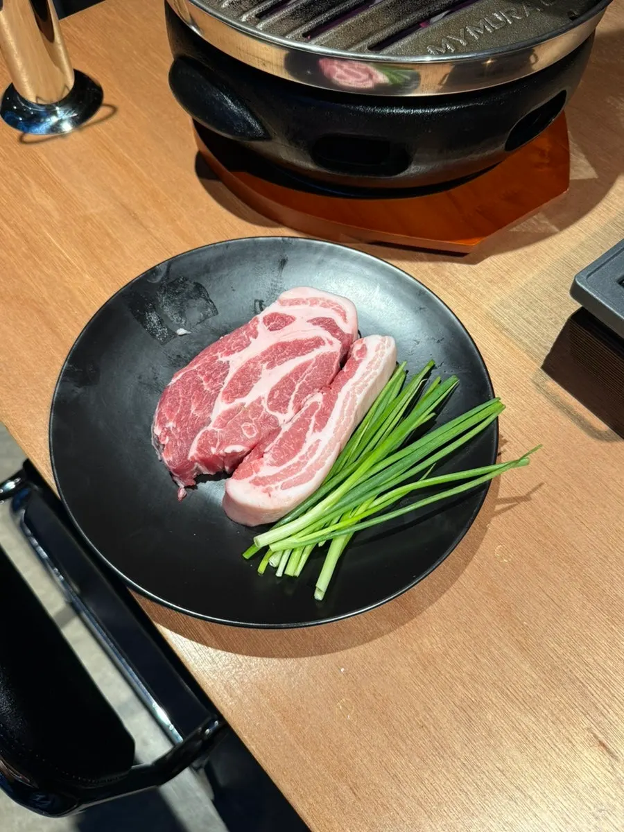 Plate of raw pork belly and pork neck ordered