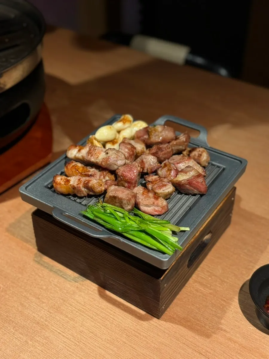 Meat over a mini brazier lit with solid fuel