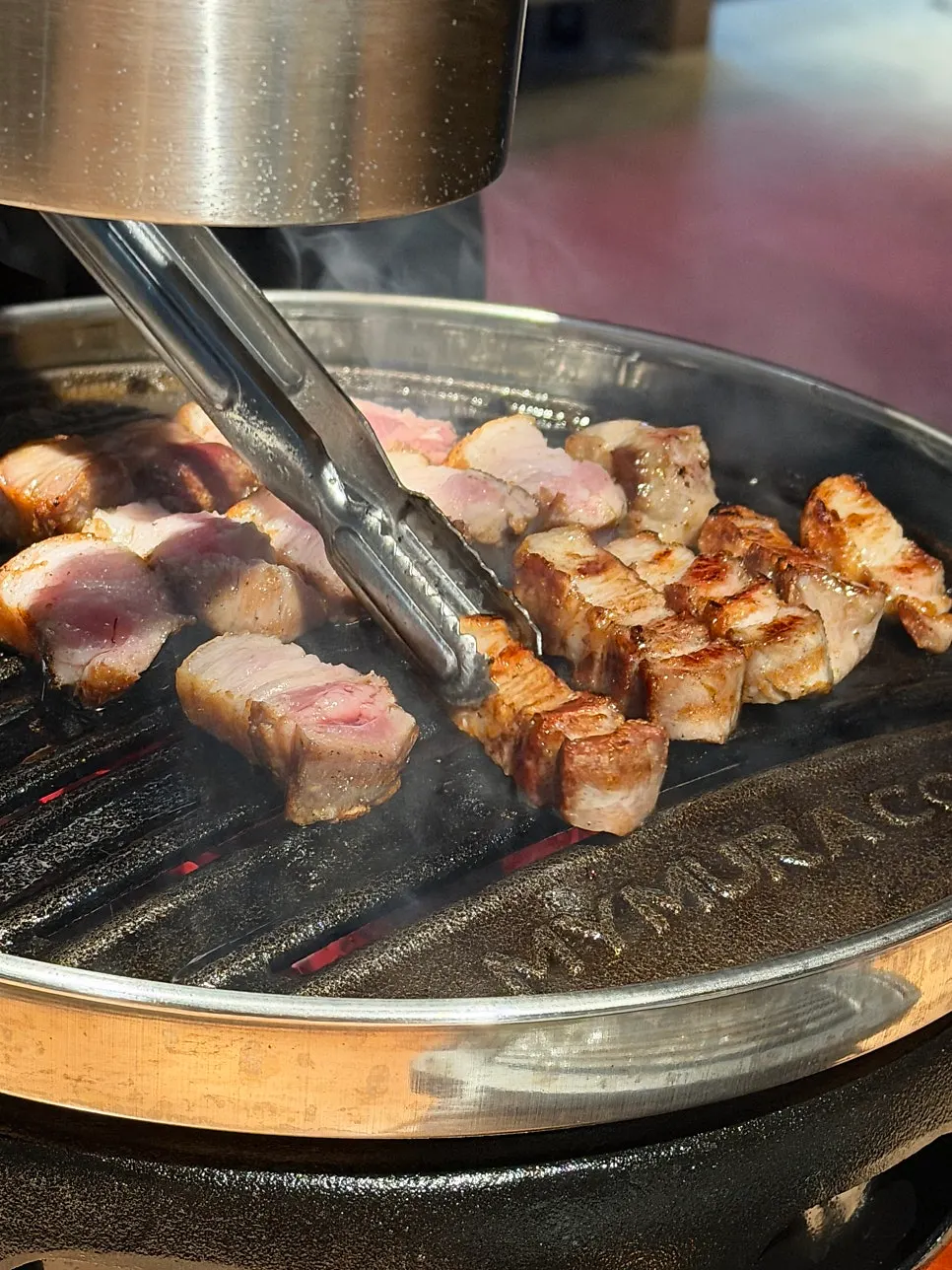 Close-up of pork belly grilling