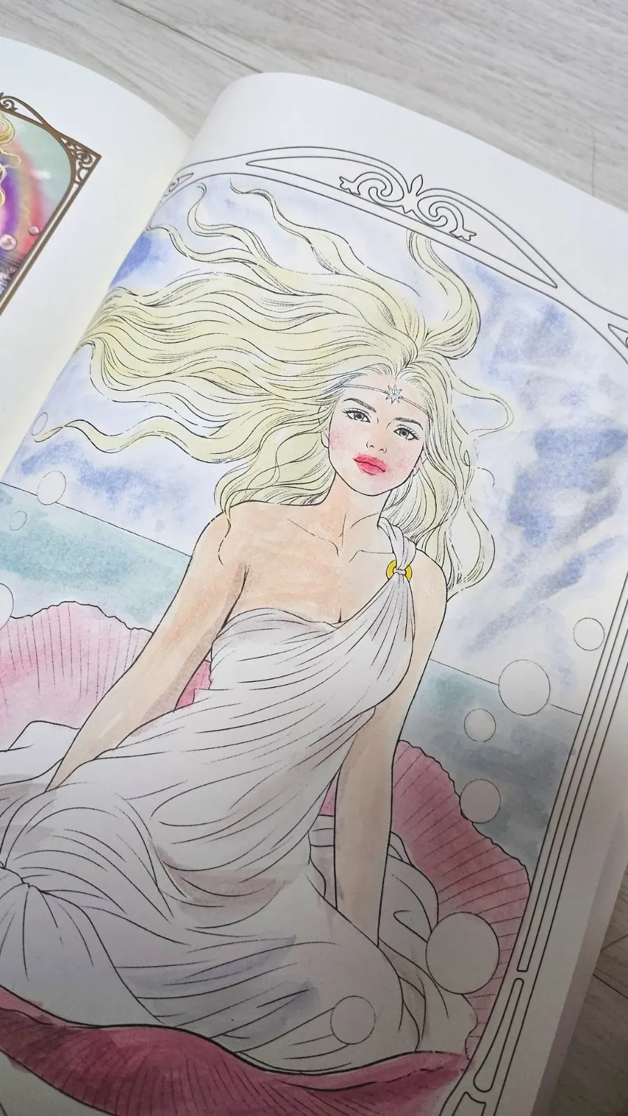 Aphrodite coloring page painted with watercolors