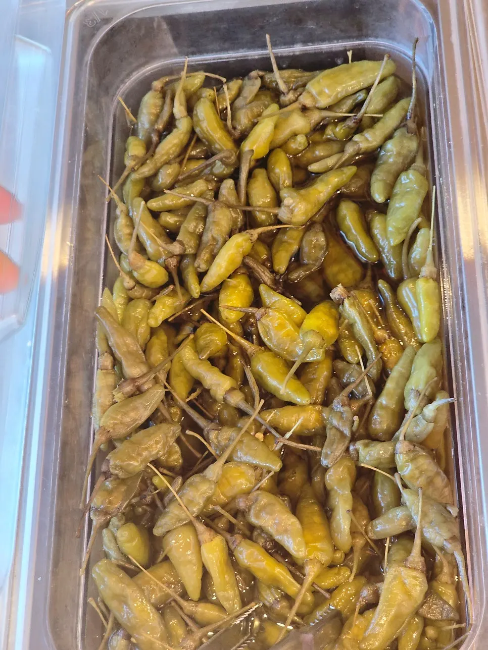 Kimchi, danmuji, rakkyo, pickled ginger, and baby spoons
